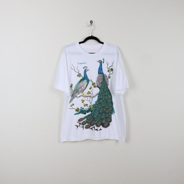 Vintage 90s White Acapulco Peacock Graphic Print Tee Colorful Feathers Bird Lover T-shirt Size 2X.jpg