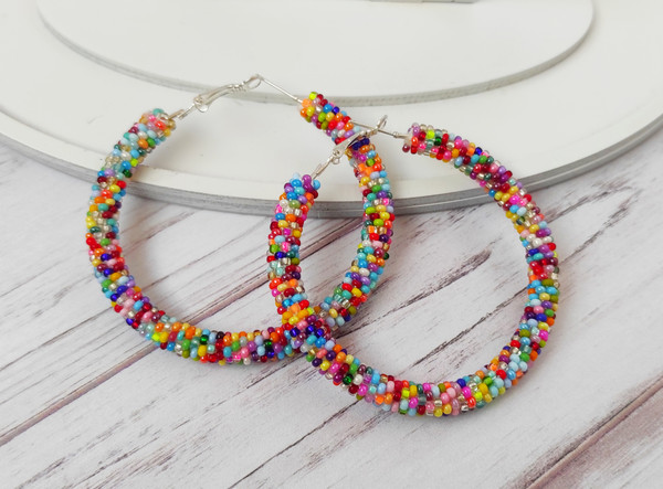 Colorful-beaded-hoop-earrings-multicolor-seed-bead-jewelry-big-hoops-native-american-beadwork-jewelry-handmade-statement-earrings.jpeg