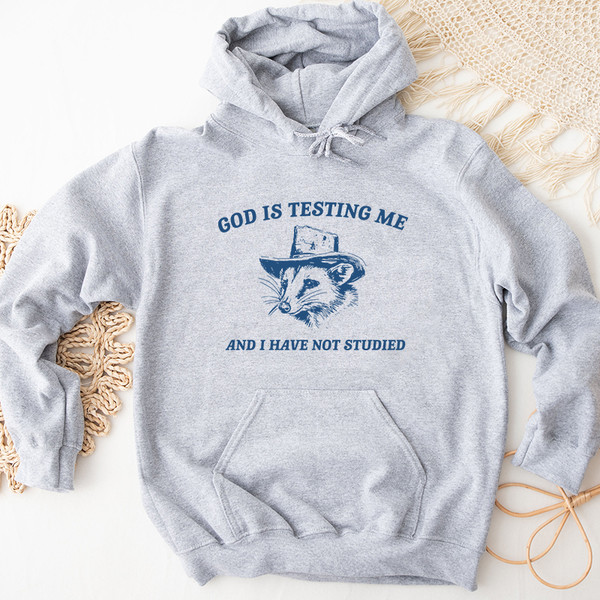 2God Is Testing Me And I Have Not Studied Graphic Hoodies.jpg