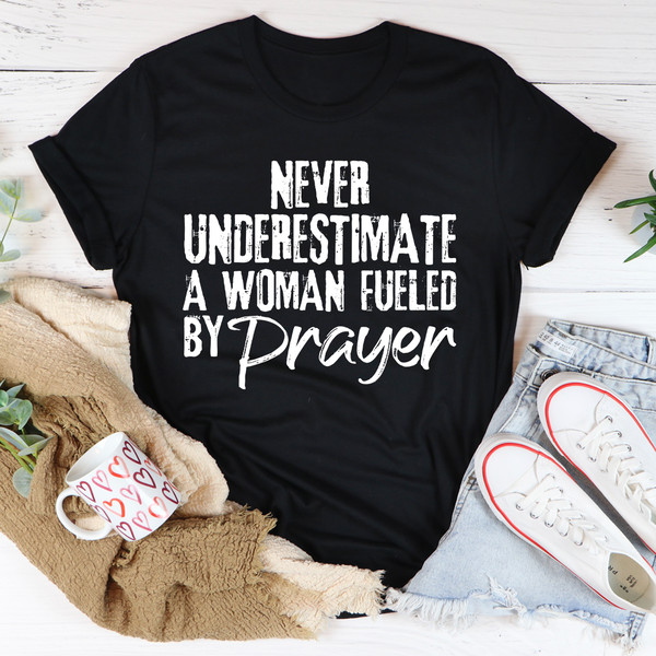 Never Underestimate A Woman Fueled By Prayer Tee (1).jpg