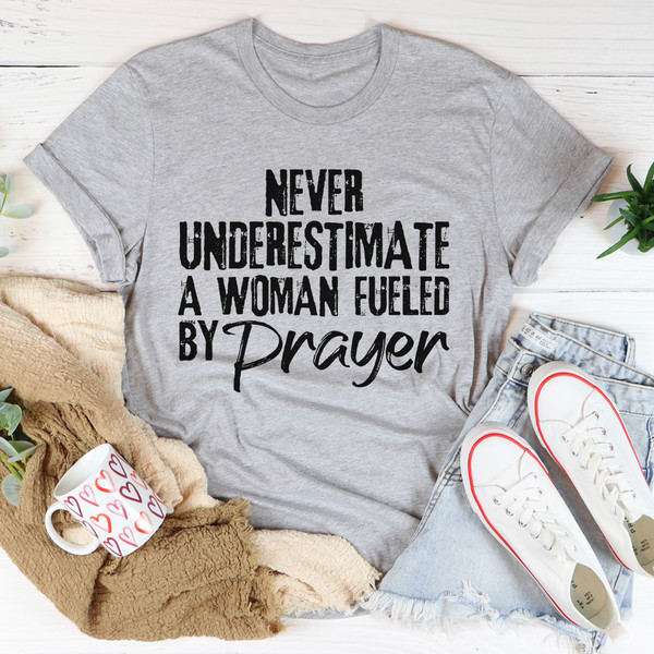 Never Underestimate A Woman Fueled By Prayer Tee (4).jpg