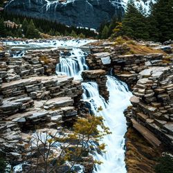 mountain scene with waterfall tileable repeating pattern