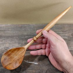 Wooden spoon from natural birch wood for cooking or serving