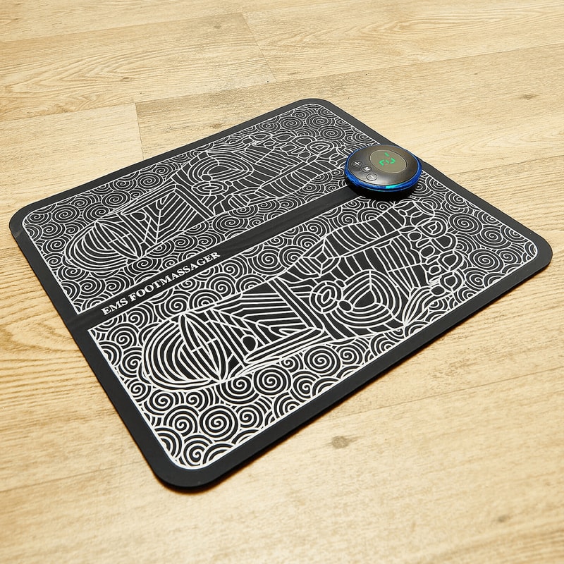 Portable EMS massage mat folded for easy travel