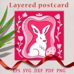 rabbit on a multi-layer postcard. paper cut svg