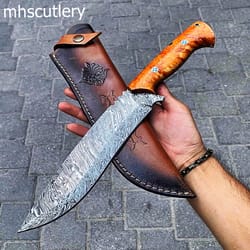 custom handmade damascus steel bushcraft hunting machete knife with resin handle and leather sheath.