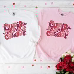 cupid find me cowboy sweatshirt, groovy retro cowgirl shirt, valentines trending shirt, trendy women