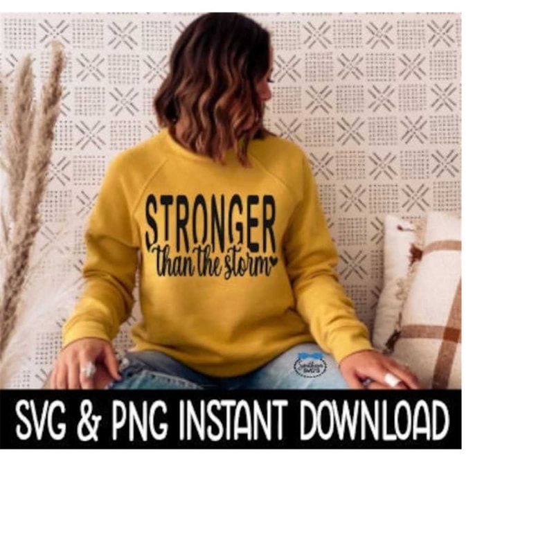 2510202393438-stronger-than-the-storm-svg-png-fall-sweatshirt-svg-file-tee-image-1.jpg