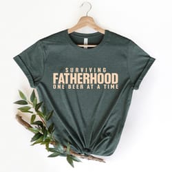 surviving fatherhood one beer at a time shirt, husband gift, fathers day gift, gift for him, gift for dad, new dad shirt