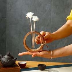 bamboo & glass aroma diffuser bottle with flower-shaped reed sticks