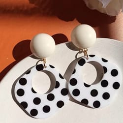 a pair of black and white large polka dot hollow geometric shape nostalgia harbor wind earrings