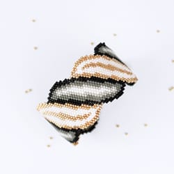 beading pattern for delica bracelet with shiny gold, white and black spiral scroll. bold design for advanced beaders!