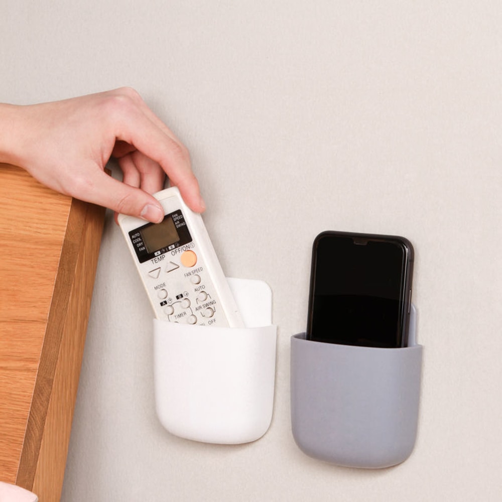 Mobile phone plug holder wall mounted