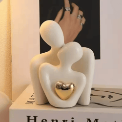 romantic couple embrace statue