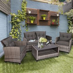 4-piece patio rattan furniture set with coffee table & cushioned sofa, modern outdoor lounge set