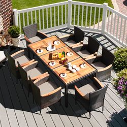 9 piece rattan dining set with acacia wood table & stackable cushioned chairs for outdoor gatherings